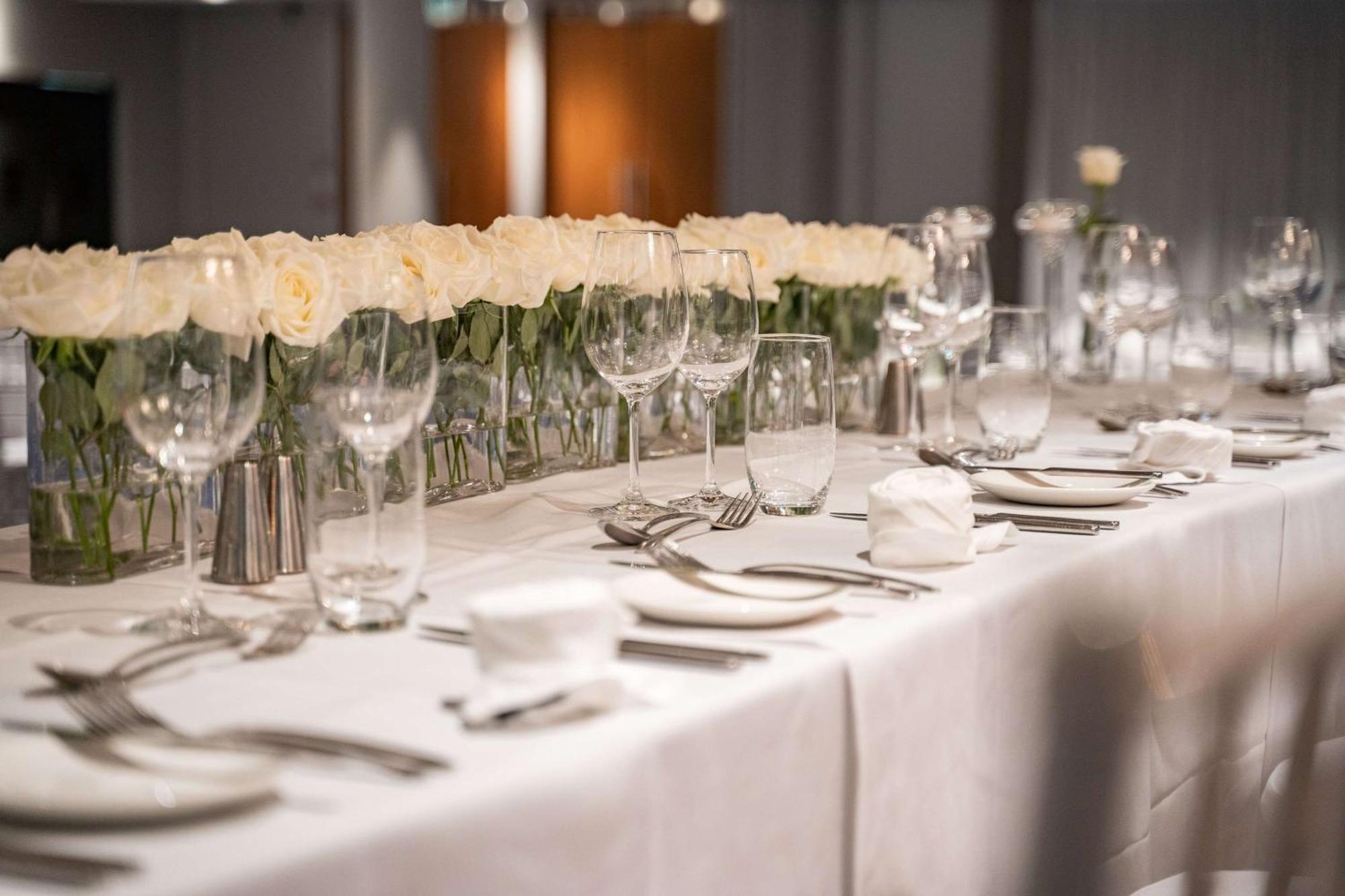 Hilton Auckland Hotel Exterior photo A table set for a formal dinner